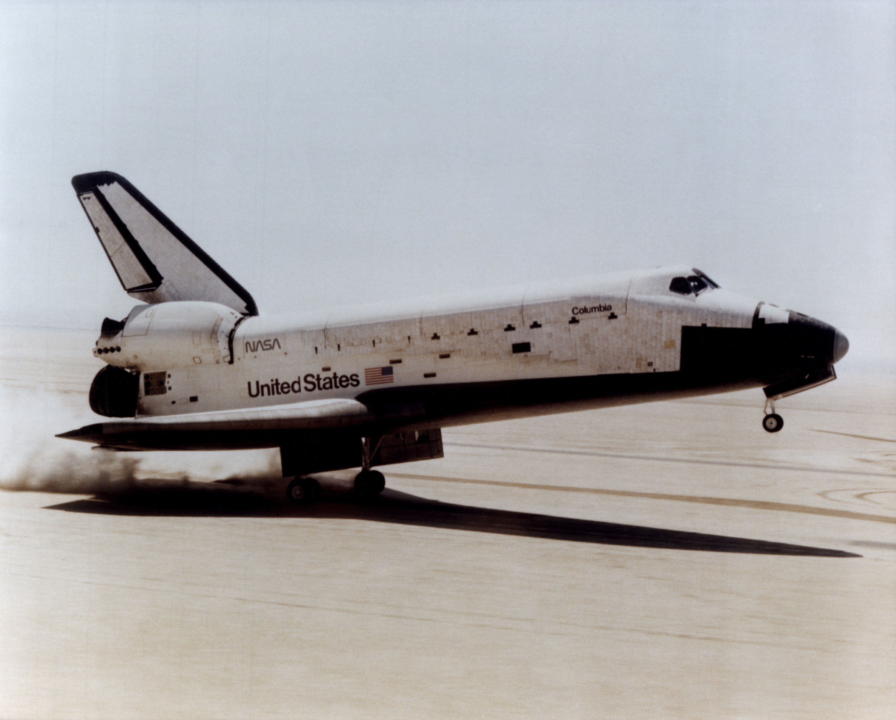 The Space Shuttle Columbia touches down on lakebed runway 23 at Edwards Air Force Base, Calif., to conclude the first orbital shuttle mission