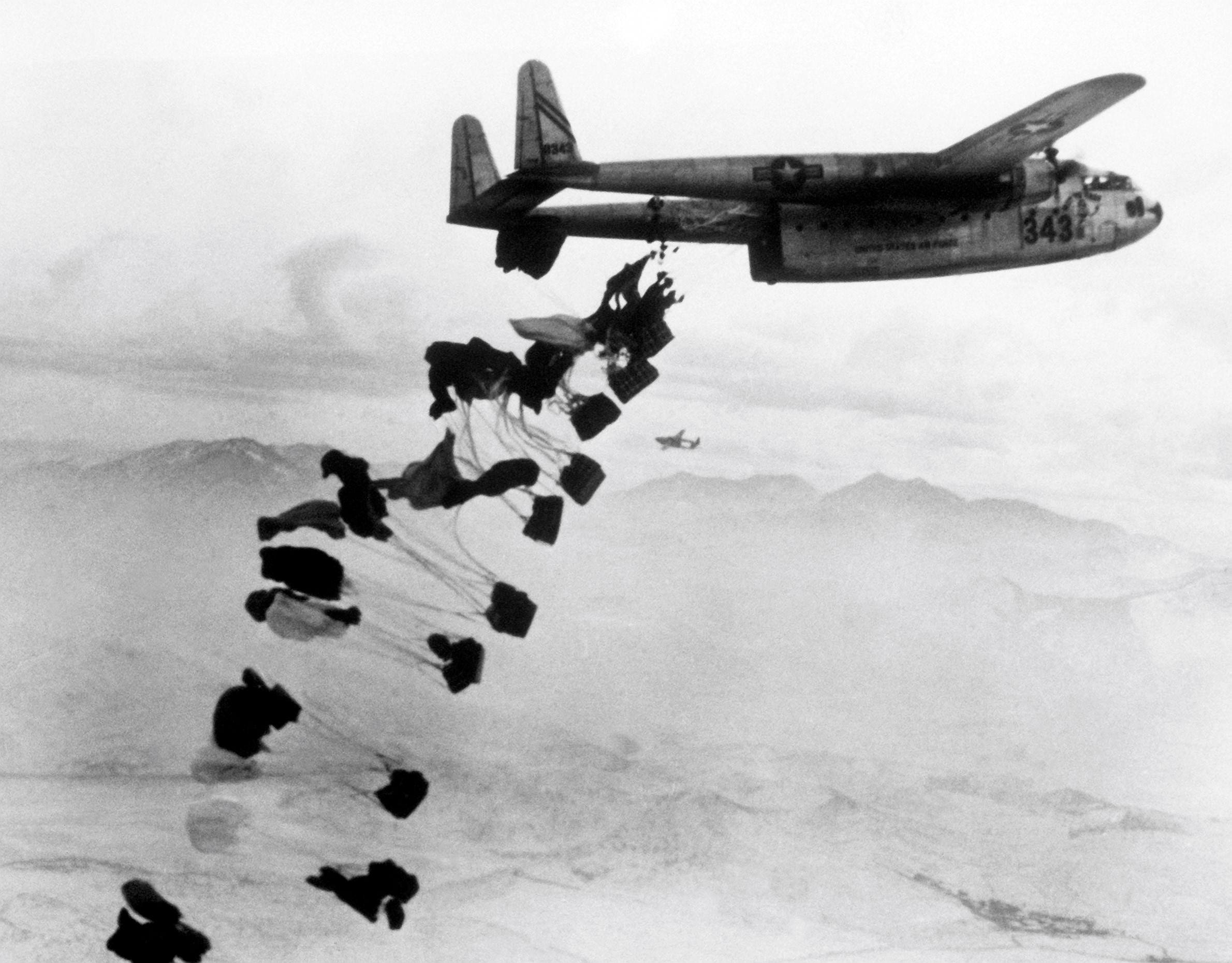C-119B_Flying_Boxcar_drops_supplies_near_Chungju_1951